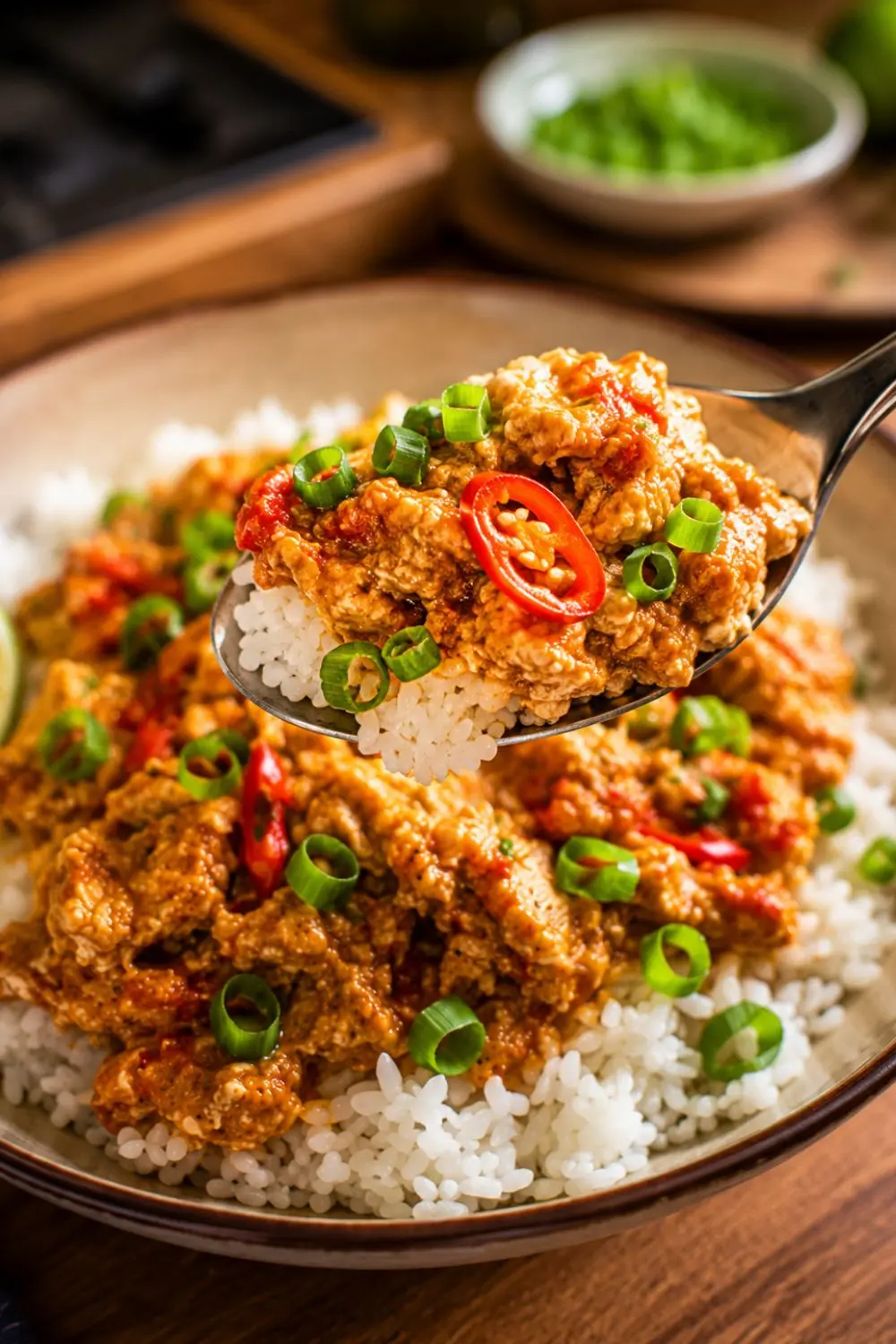create same image with 90 degree angle with more clearity and super close up, with one spoon of surving Slow Cooker Vegan Spicy Peanut Tofu